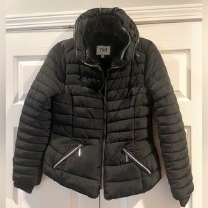YMI women’s size Medium black puffer coat. Has two small holes in the back